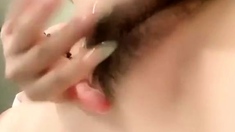 Cute Japanese teen drilling her hairy muff uncensored