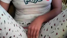 Amateur girl rubs her pussy through pajamas